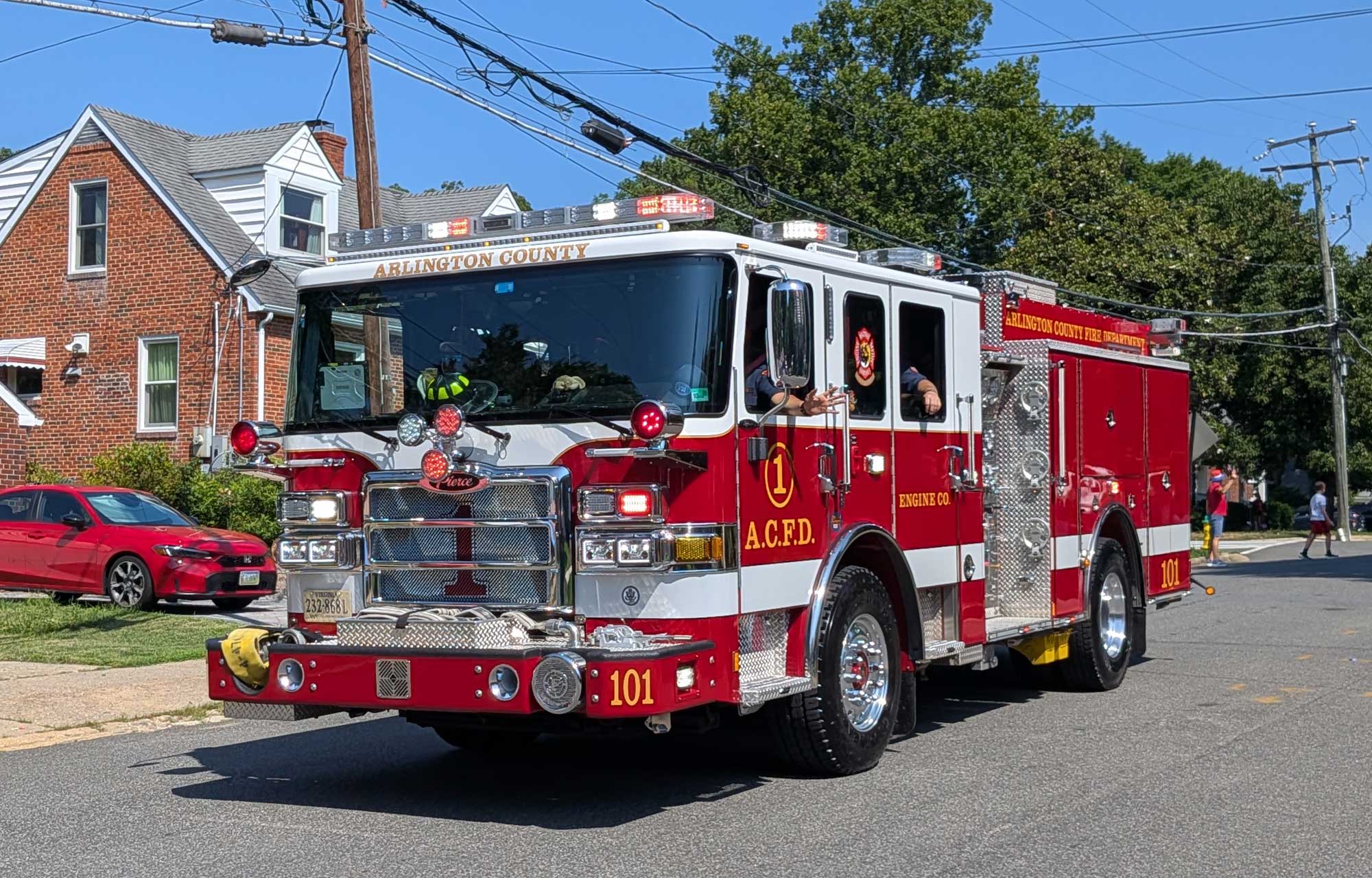 fire truck at the end of the parade with siren