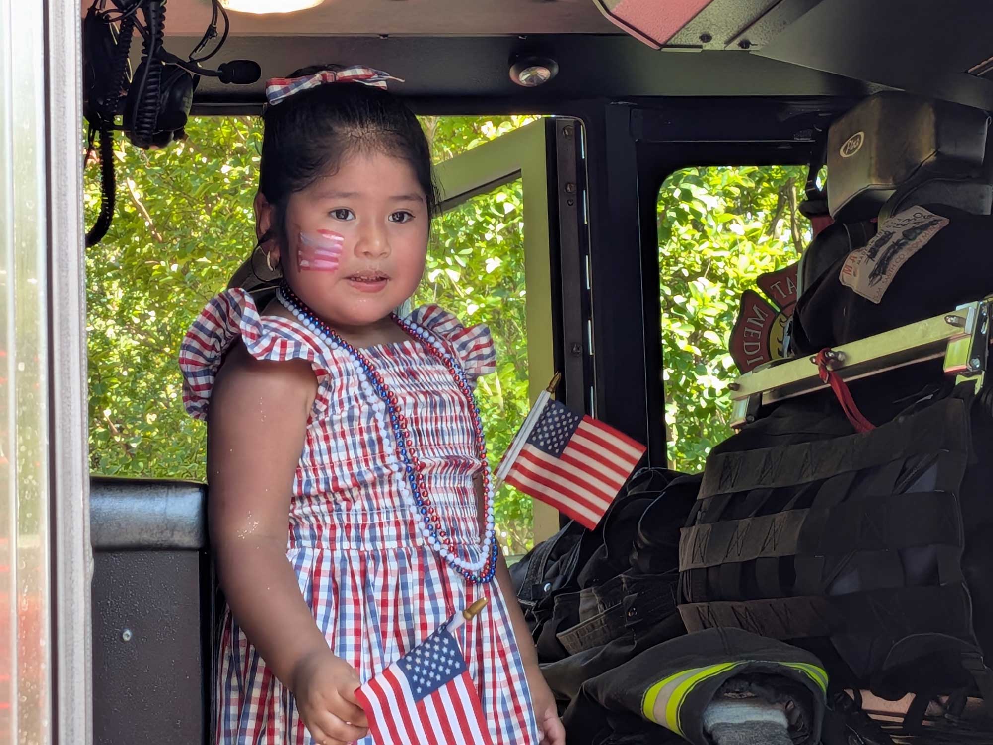 Girl in fire truck